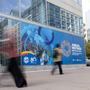 Banner on side of building promotes World Bank and IMF Annual Meetings in Washington DC, October 2024.