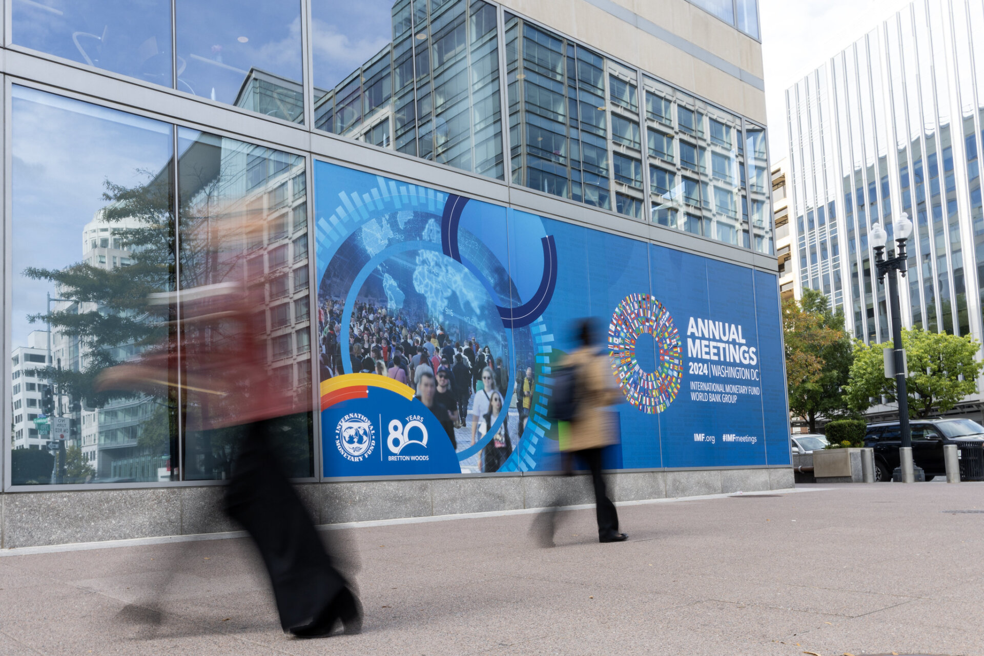 Banner on side of building promotes World Bank and IMF Annual Meetings in Washington DC, October 2024.