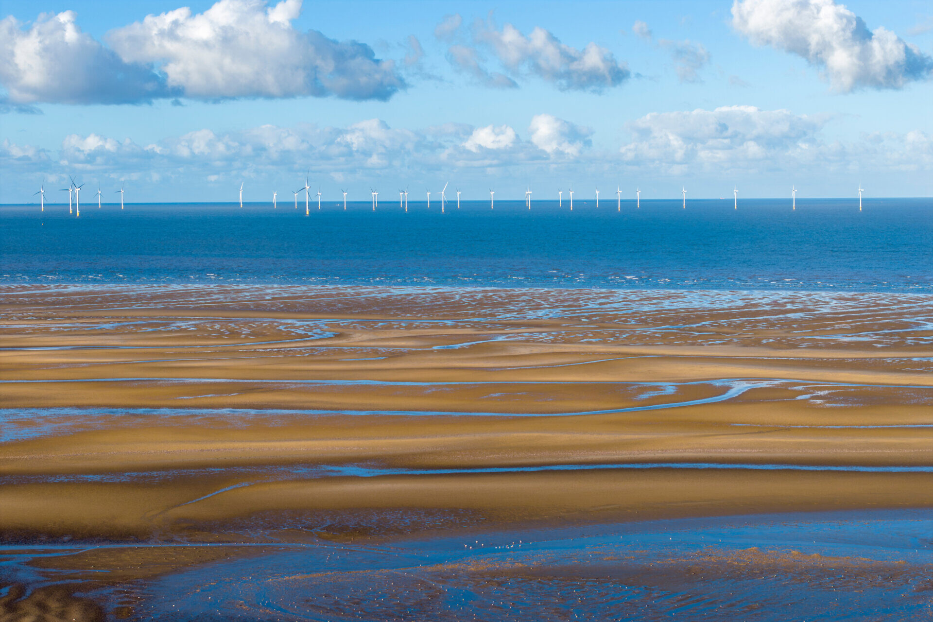 Wind turbines in the Irish Sea off the Wirral coast, England