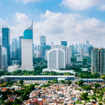 Panoramic view of Jakarta cityscape with residential houses, modern office and apartment buildings