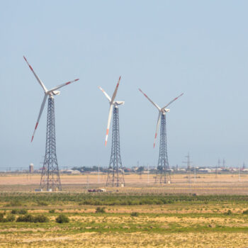 Wind generators in the background in Azerbaijan. Nature ecology concept.