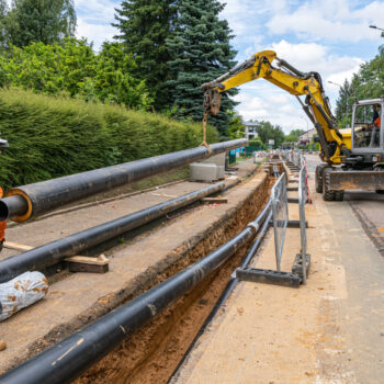 Installing district heating pipes.